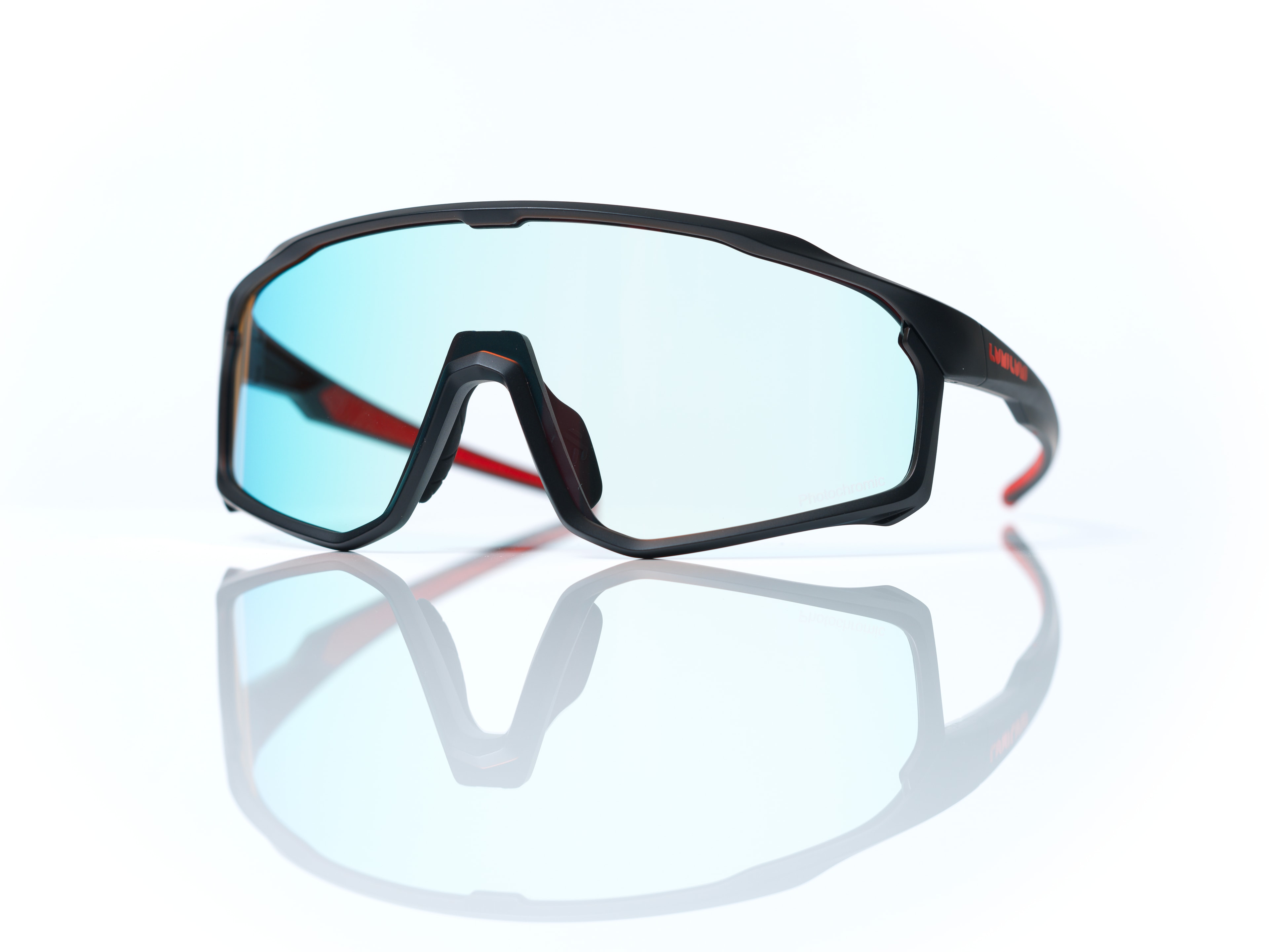 A pair of sports sunglasses with a black frame and red highlights.